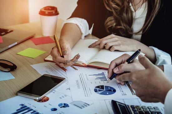 Financial Advisor, Accounting And Investment Concept, Business Owners Consult Adviser Financial Meeting To Analyze And On The Finance Report In The His Office Room.